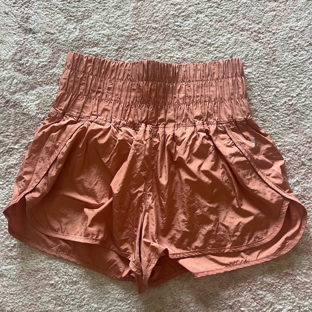 Pink Athletic Shorts with Elastic Waistband and Curved Hem